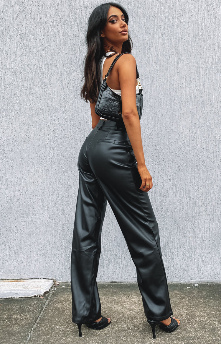 Black faux leather high-waisted pants with a relaxed straight leg