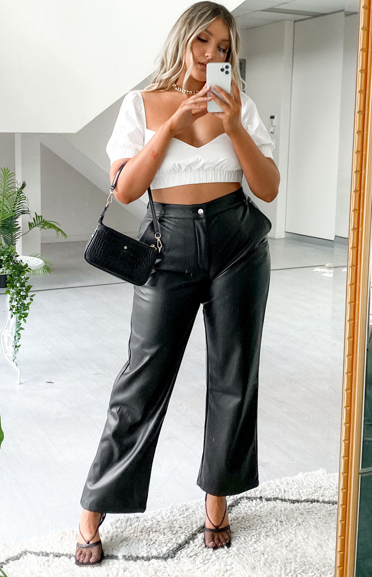 Black high-waisted PU pants with a straight leg and relaxed fit