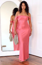 Full length front view of a pink satin off-shoulder maxi dress with a draped neckline