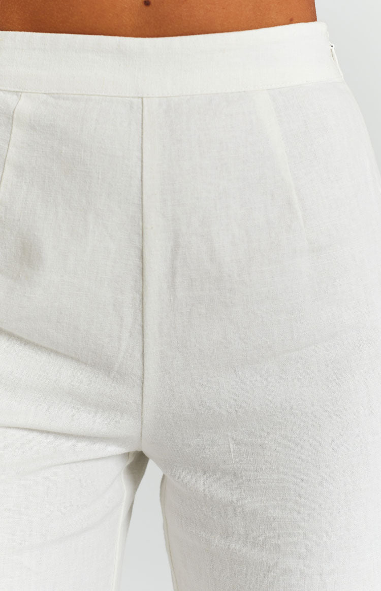 White linen high-waisted wide-leg pants with a relaxed fit and full length