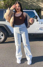 Light blue wash wide leg jeans with ripped knees