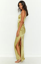 Side view of a green satin maxi dress with side cutouts, a corset bodice, and a high side slit