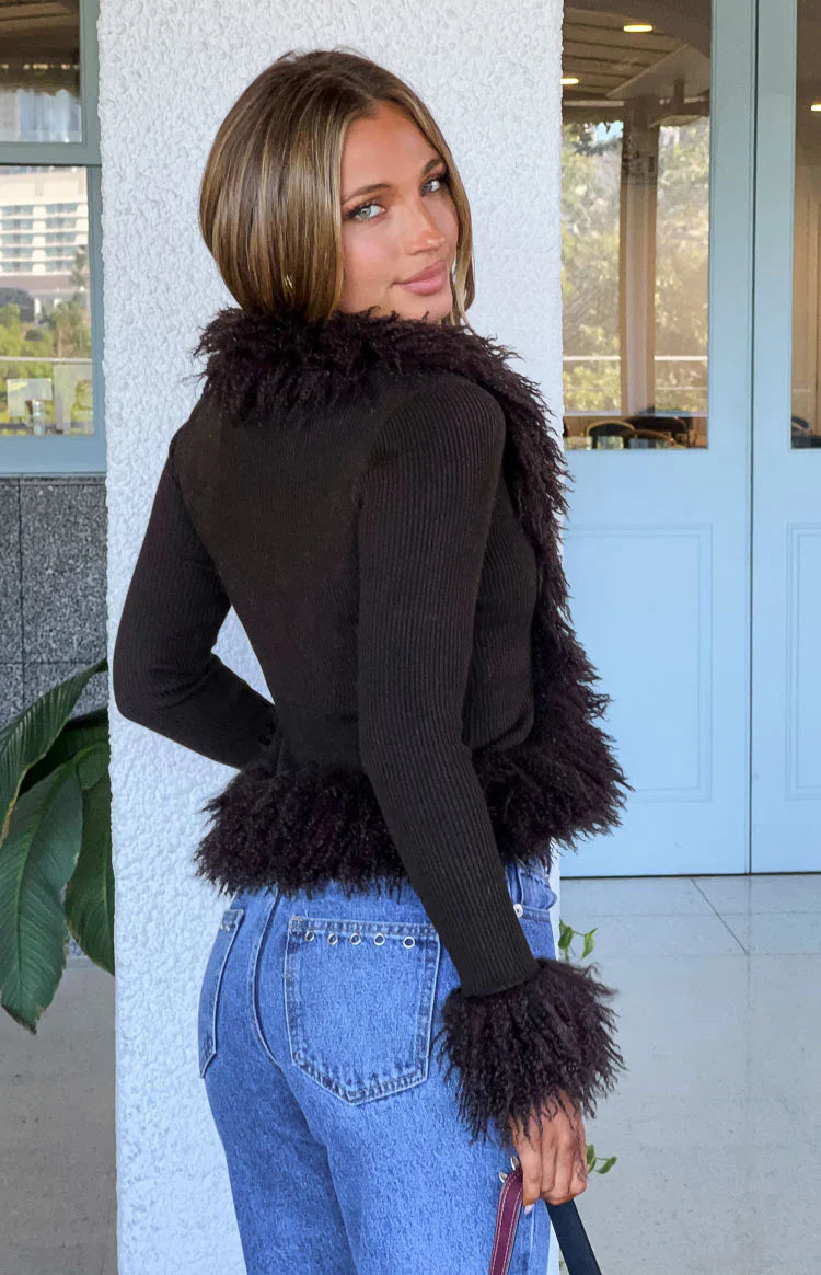 Chocolate ribbed knit cardigan with a deep V-neckline and fluffy fur trim along the front opening and cuffs