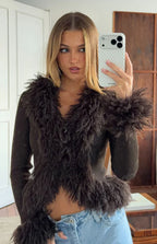 Chocolate ribbed knit cardigan with shaggy fur trim V-neckline, long sleeves with fur cuffs, and cropped hem