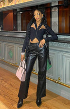Black high-waisted PU wide leg pants with tailored back pockets